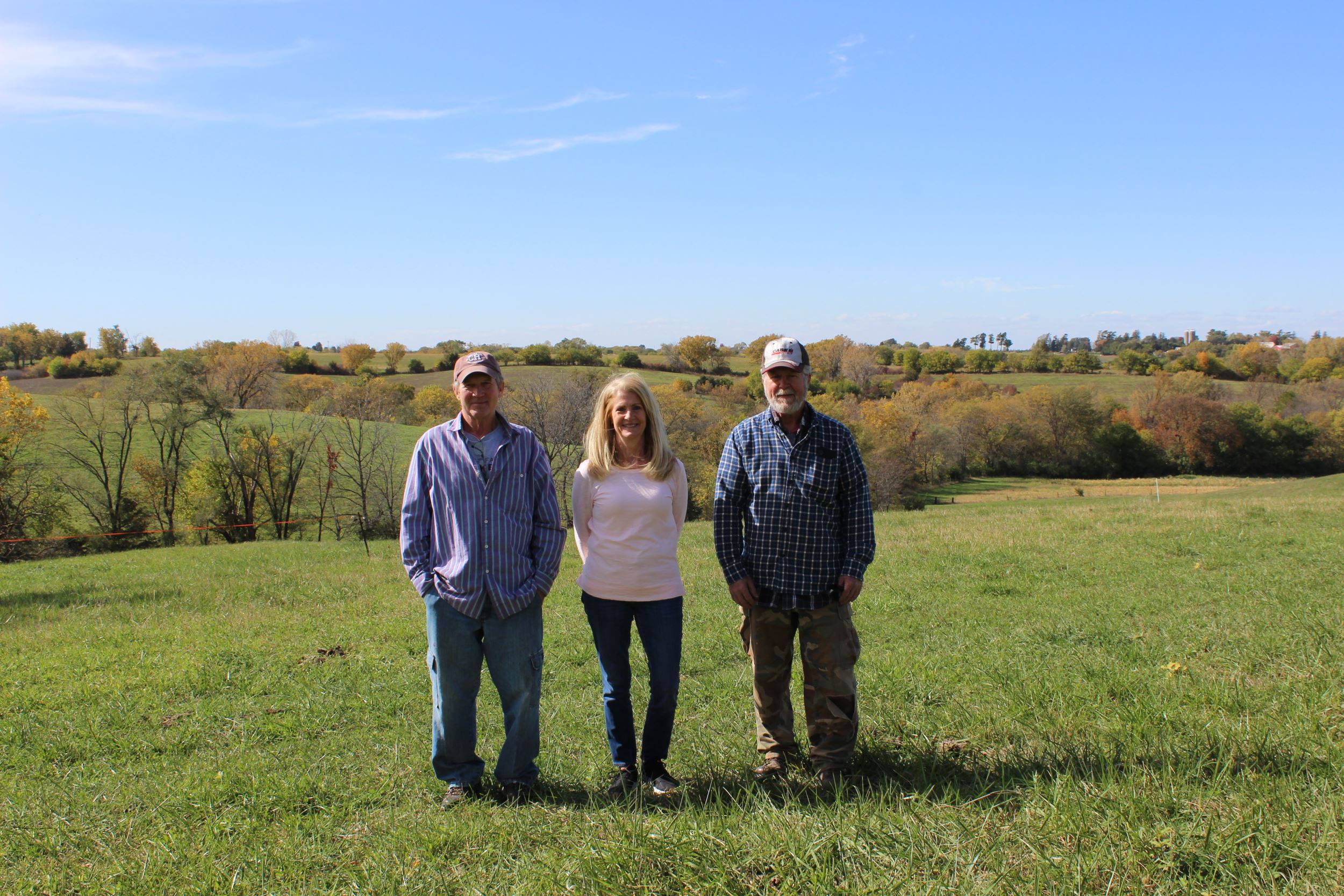 Three McLaughlin siblings pictured at their farm
