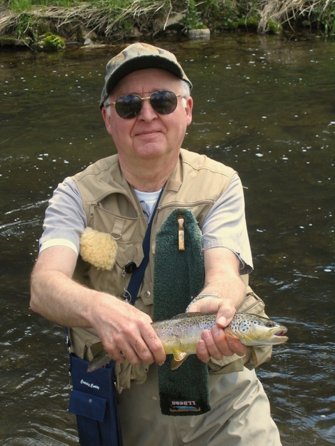 Ed Power holding a fish at the creek