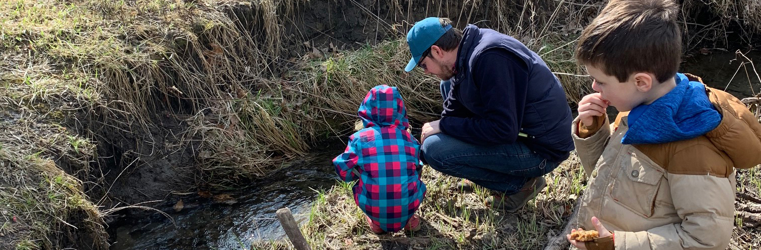 kids on creek bank