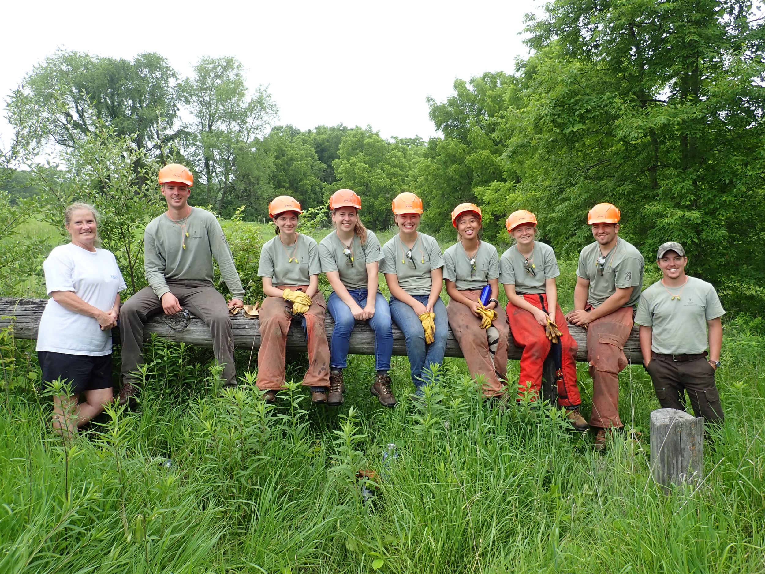 Cindy Burke pictured with INHF Stewardship interns working on her property.