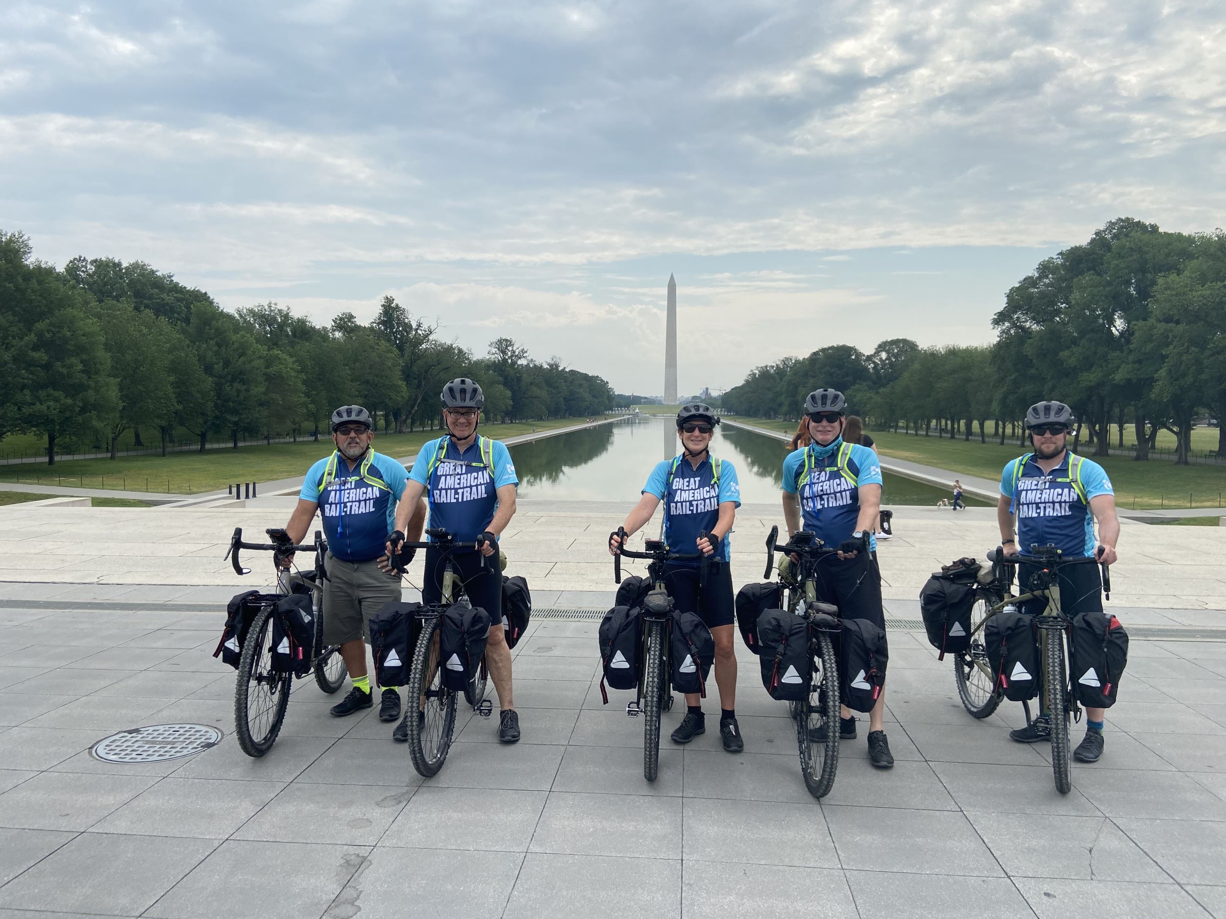 Group of cyclists in front of the Washington Monument in Washington, D.C.