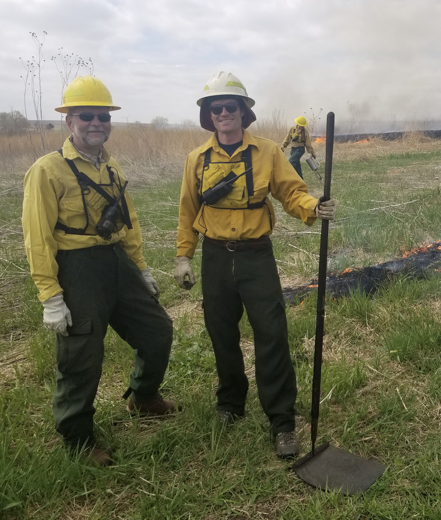 Volunteers Jeff Jutting and David Brady assist with a prescribed burn.