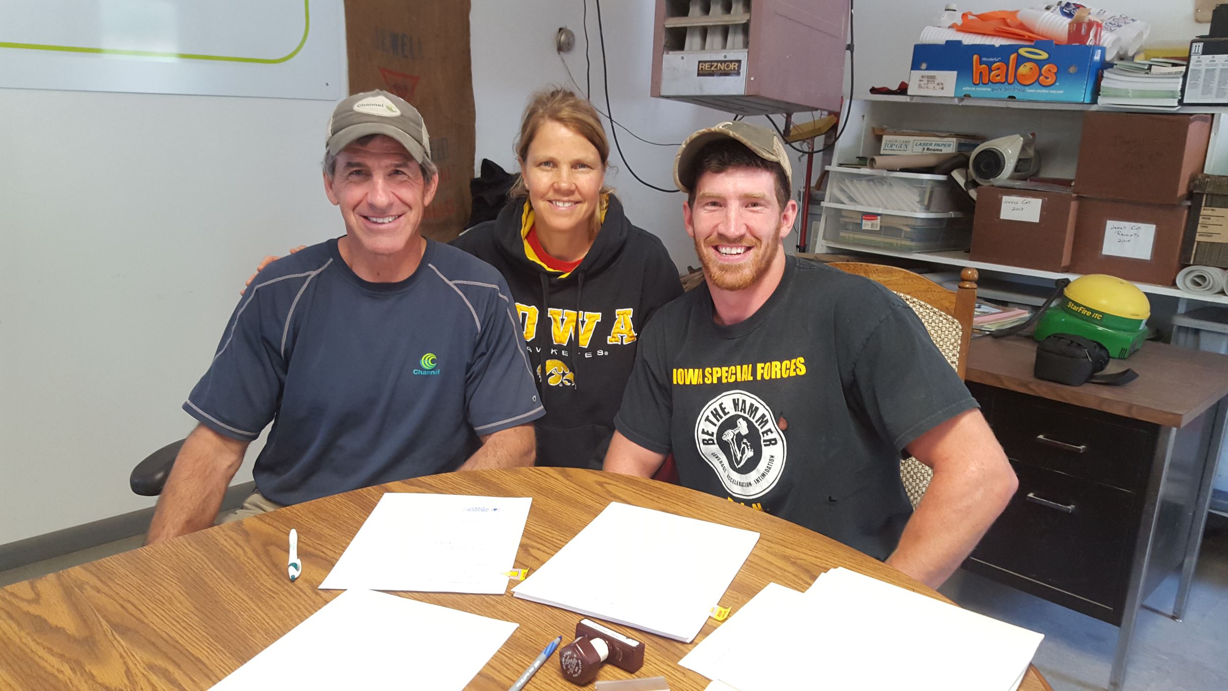 Jewell family signing agricultural land easement