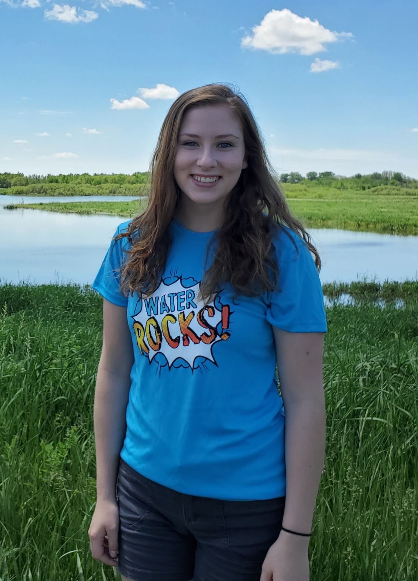 Allison in front of a wetland.