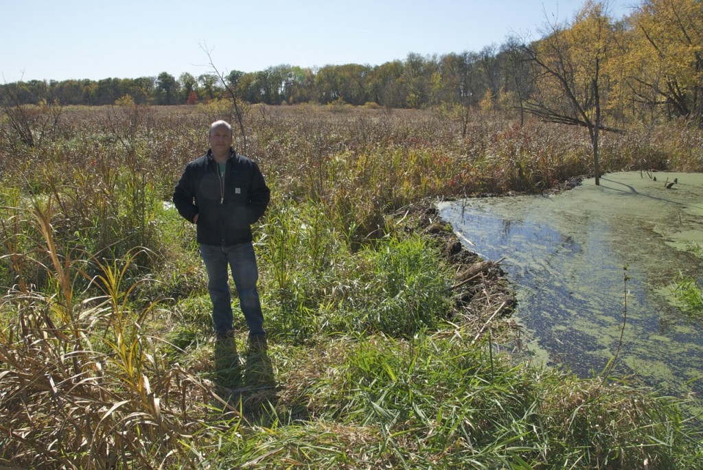 Matt Fisher, Eastern Iowa Project Director for The Nature Conservancy, in a Lower Cedar wetland at the conservation group's Maytag Tract in Muscatine County.